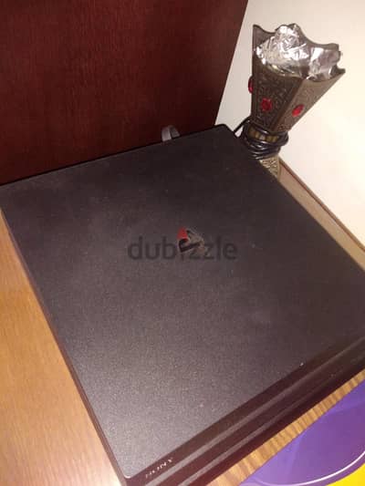playstation 4 pro used with 6 games and 3 controllers