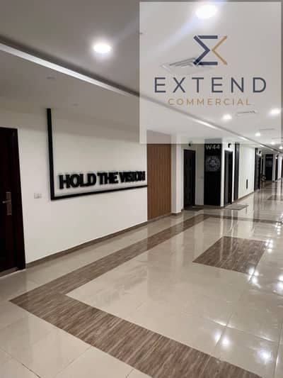 Administrative office for rent inside a commercial mall in the heart of 6 October on the central axis in front of the University of Culture and Science at the best prices