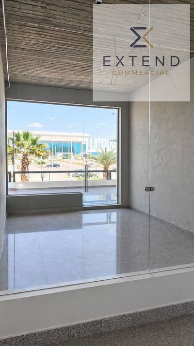 In front of the University of Culture and Science, suitable for all types of activities and the lowest price per meter, a shop for rent inside a commercial mall on the central axis in the heart of 6 October.