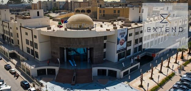Administrative unit for rent with an area of 99.4m inside a commercial mall in the heart of 6 October on the central axis near Al-Hosary Square