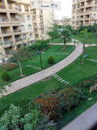 For sale in Madinaty, a bargain price: a 103 sq m apartment in B6, directly on the sea, second floor, with a wide garden view. Located near Talaat Mos