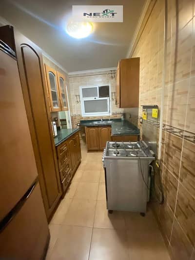 Furnished apartment for rent in Madinaty, 90 sq m in B6, high-end finishing, clean furnishings, unobstructed sea view, wide garden view, very close to