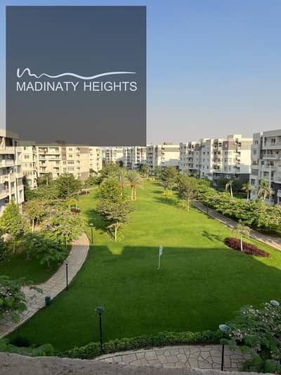 For rent, a law in my city B10, a distinguished apartment in a strategic location directly in front of All Seasons Park. Area: 200 square meters, fourth floor with a clear garden view, 4 bedrooms, 3 bathrooms, spacious reception, kitchen, suitable for all nationalities. Rent: 30,000 EGP per month.
