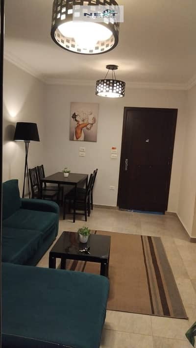 Furnished apartment for rent in Madinaty, 70 sq m in B7, high-end finishing, modern furnishings, clear sea view of the street and garden, very close t