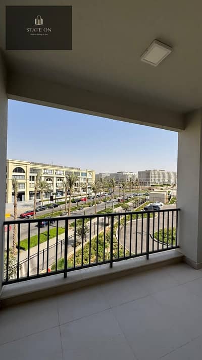 Fully furnished apartment for rent in Mivida Boulevard Views with a swimming pool view, ready for immediate move-in.