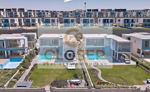 تاون هاوس للبيع بإطلالة مرتفعة على البحر والمارينا بحديقة خاصة ف سولت الساحل الشمالي تطوير مصر