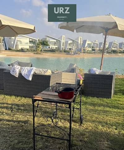 Ground-floor chalet with garden, first row lagoon view, ACs, installments, and 35% discount in Ras El Hekma near The Med, Azha & Cascades.