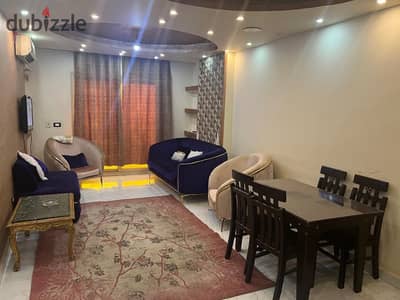 Furnished apartment for rent, air-conditioned, in the eighth section, open view, 120 sqm, consisting of 2 rooms - reception - kitchen - bathroom, on the 8th floor, there is an elevator, ultra finish