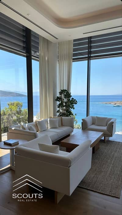 شقة للبيع صف اول على البحر Fully Finished بالتكييفات Sea View بانورامى فى ذا جيت the gate براج العلمين الساحل الشمالي North Coast