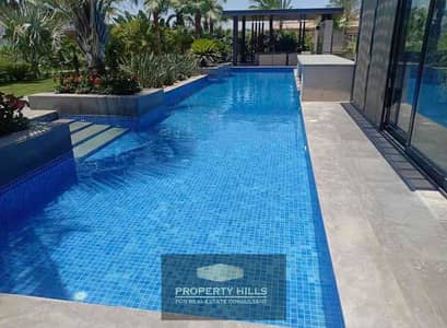 Examine and receive immediately in installments a villa with a private swimming pool on Dahshour link opposite Kababgy Palace and Beverly Hills and 6 West and La Casa and West Town next to the Patio Vera and Dunes Levels in Zayed