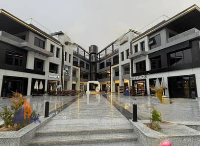 Commercial space for sale, immediate occupancy, currently rented monthly to a cafe for 116,700 EGP, located opposite one of the largest clubs in the h