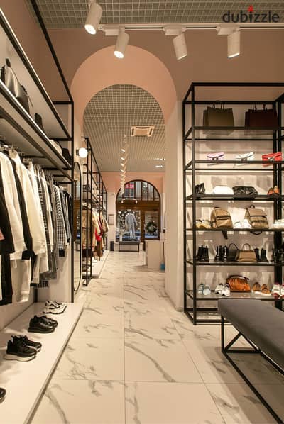 Ground floor commercial shop for sale directly in front of El Rehman Gate on El Sadat Axis, near Cairo International Airport.  Project: (By 9)
