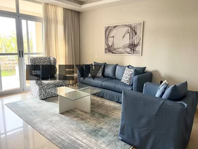 Two-bedroom apartment with a private garden for rent in Cairo Festival City; features ultra-super-lux finishes and an optimal layout. Ready to move
