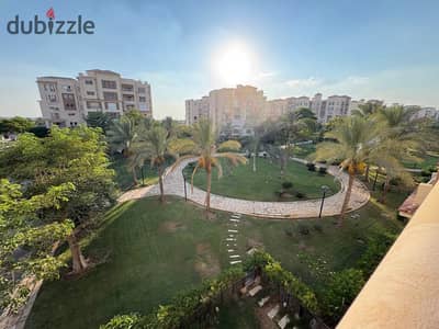 For sale in Madinaty, an apartment of 245 meters on the third floor with a wide garden view and close to the club.