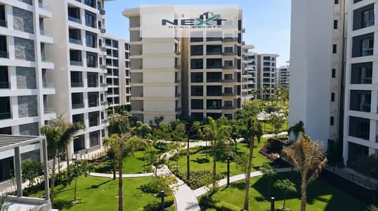 For sale in Noor City: A prime 108m² apartment (2021 booking, 15-year payment plan with remaining installments). Features the best layout, a garden vi