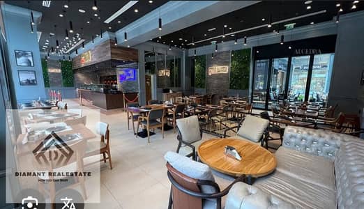 Shop for sale currently rented for 130,000 per month, Suitable for restaurant or cafe, located in first shopping mall with direct view of iconic tower