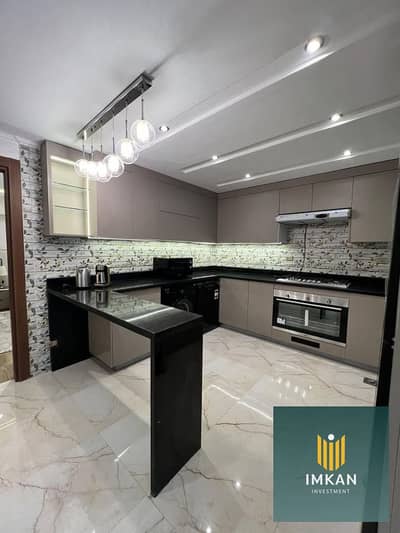 Fully furnished apartment for sale in the Amorada Compound, Fifth Settlement. It features "super-lux" hotel-style finishing and is ready for immediate