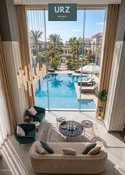 قسيط علي 15 سنة luxury villa فاخرة Double Hights فيو خيالي علي pool في العاصمة الادارية للبيع علي النهر الاخضر و بالقرب من البرج الايقوني