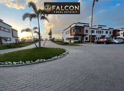 with 33% Discount Own a Corner Town House Cheaper than Apartment Beside the Middle Ring Road & Sokhna Road in Azzar Compound , 6th Settlement