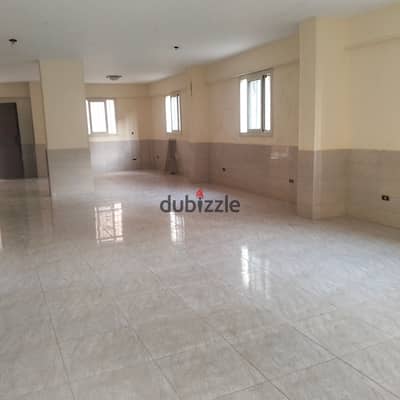 For rent: a basement in the best location in the first neighborhood, adjacent to the fifth section, with two entrances, including a main entrance. Super luxury finishing suitable for any activity without noise, signage, or storage. It consists of two rooms, a bathroom, and a kitchen, with a large area of 180 m, excluding the two rooms, bathroom, and kitchen, branching off from Central Street, minutes from the 26th of July axis.
