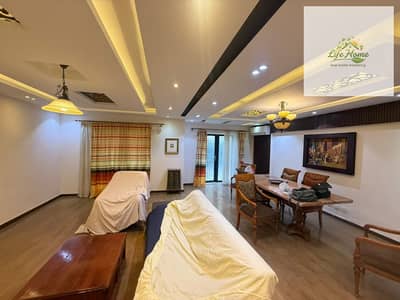 Furnished apartment for rent in Al Rehab, three bedrooms and two bathrooms, ground floor with a garden