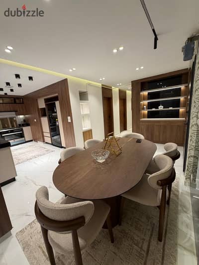 A high-end furnished apartment for rent in Al-Rehab City, ground floor with a garden