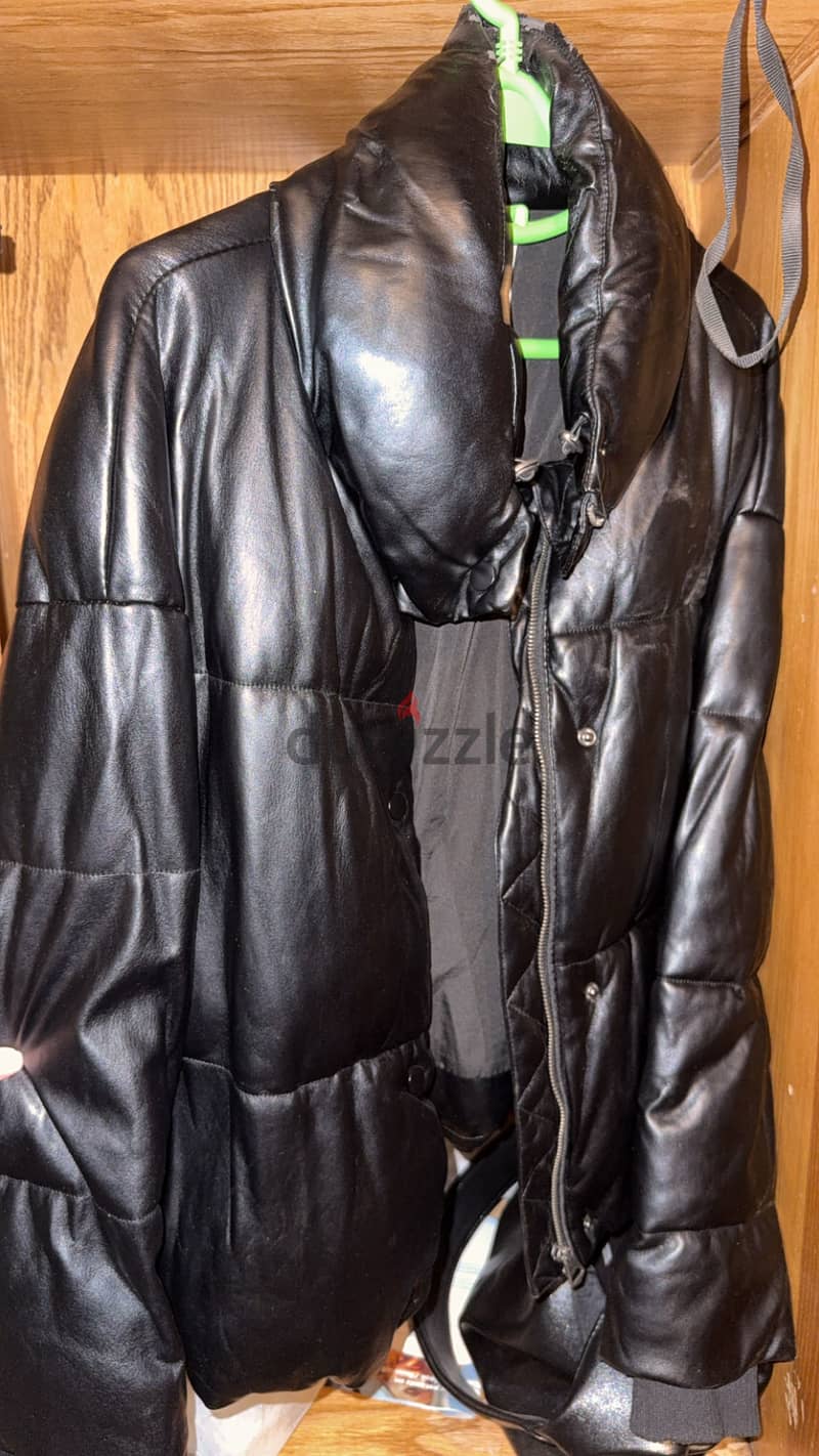 Women’s Black leather puffer jacket. 2