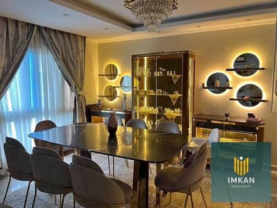 Fully furnished apartment for sale in the Amorada Compound, Fifth Settlement. It features "super-lux" hotel-style finishing and is ready for immediate