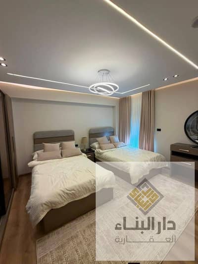 ready to move fully finished over 12 years  payment apartment for sale in new garden city new capital new cairo , next to al maqsed and sarai