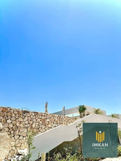 Chalet for sale in Jali, North Coast, with a 900,000 down payment; fully finished, furnished, and equipped with air conditioning. Located directly fac