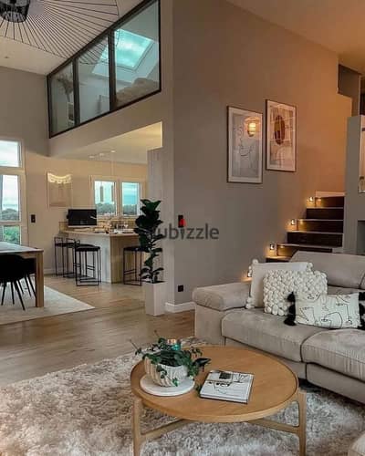 Townhouse with garden and private roof terrace for sale with a 50% discount in a prime strategic location in Mostakbal City.