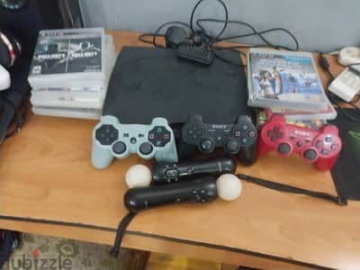 ps3 slim with 3 controller and 15 games and camera and2motioncontrolle