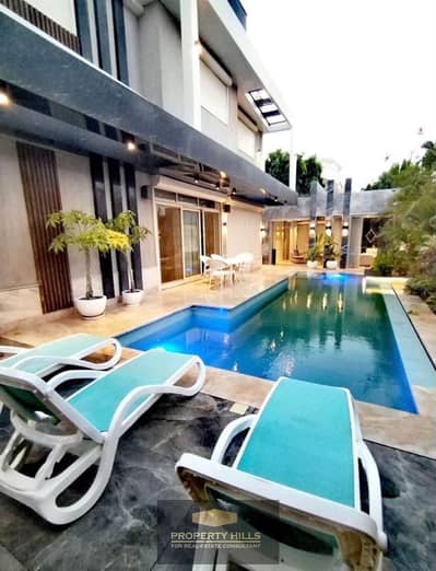 A villa with a panoramic view, 362 meters, 3 floors with a private swimming pool in Sheikh Zayed, next to Mountain View, Nyoum, and Al Karma.