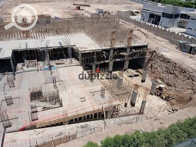 Unique commercial store for sale with direct frontage on the plaza, pay 25% upfront, and the first installment upon receipt and operation, delivery within a year and a half in Sheikh Zayed, in front of The Gate Plaza.
