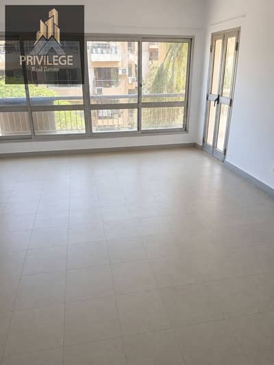 For rent in the second section of Zahra Maadi, a 126 sqm apartment, two rooms and terraces overlooking a garden, elevator and garage, a prime location close to all services.