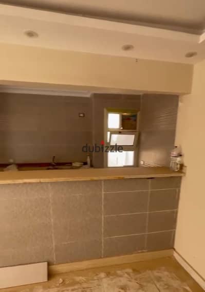 Luxury apartment for sale cash 1,500,000 EGP in the Egyptian House Compound, October Gardens, directly on the main road. Immediate delivery with meters near Zewail University.