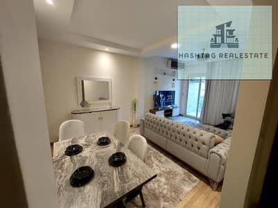 For rent, a modern furnished apartment in The Address Compound, Sheikh Zayed. 3 rooms, 3 bathrooms, fully furnished, fully air-conditioned, pool view.