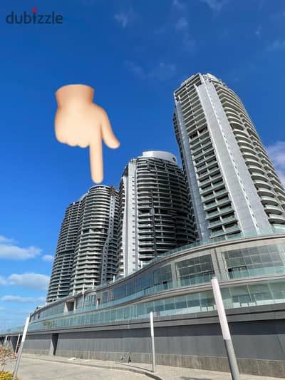 Receive now apartment VIP in El Alamein Towers double-view , directly on the sea, fully finished with hotel finishing, immediate delivery