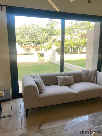 For less than market price, a ready-to-view apartment in Al Burouj compound in El Shorouk, in front of the International Medical Center, with a large garden.