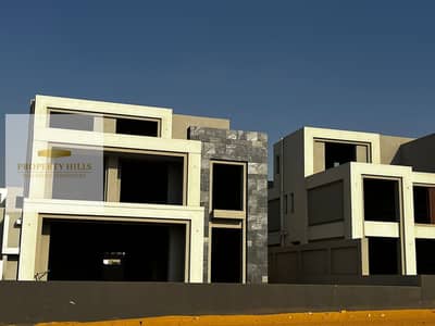 Villa for sale with complete finishes in Al Patio Town compound with an open view of swimming pools in Al Patio Town next to the American University.