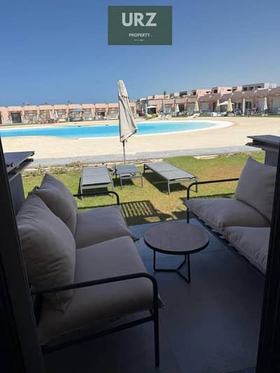 "2-bedroom beachfront chalet fully sea view in North Coast near New Alamein Towers Marina  Mazarine Installments discounts  nearest delivery