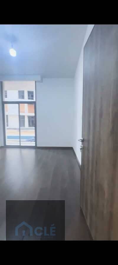 Super Lux apartment with a private garden overlooking the pool in The Capital Way compound, in the New Administrative Capital. BUA 188 , garden 70 sqm