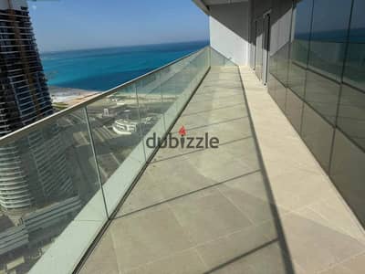 Fully finished chalet for sale—featuring hotel-standard interiors—located in the towers of New Alamein City (North Coast), boasting a direct panoramic