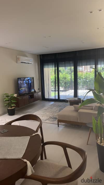 For rent Furnished apartment   at Azad Compound ground with garden front of AUC and sodic Eastown – New Cairo,