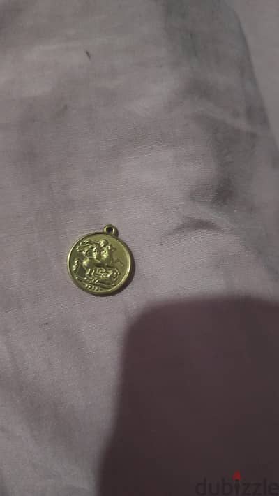 جنيه دهب مطلي بماء ذهب