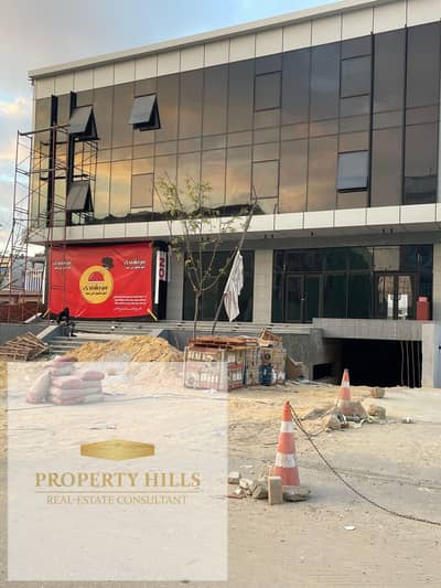 A fully equipped commercial building in Fifth Settlement, in a prime location, with a large area and basement.