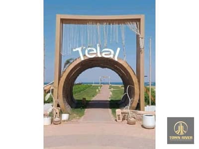 Twin house for sale in Telal Ain Sokhna, featuring a spectacular view; fully finished and tastefully furnished. The resort offers a full range of amen