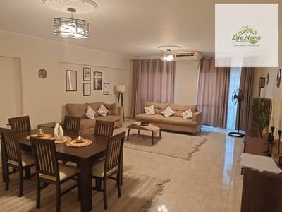 Furnished apartment for rent in Al Rehab with three bedrooms and two bathrooms, close to Avenue Mall