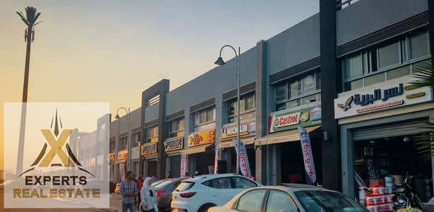 محل للبيع في الكرافت زون مدينتي | 74م مركز خدمة سيارات | سعر لن يتكرر | مؤجر واستلام فوري | خالص الأقساط