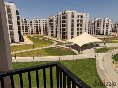 Apartment for rent in the compound in front of Village West with kitchen and air conditioning, 3 rooms, 140m near Hyper and the Alexandria Desert Road
